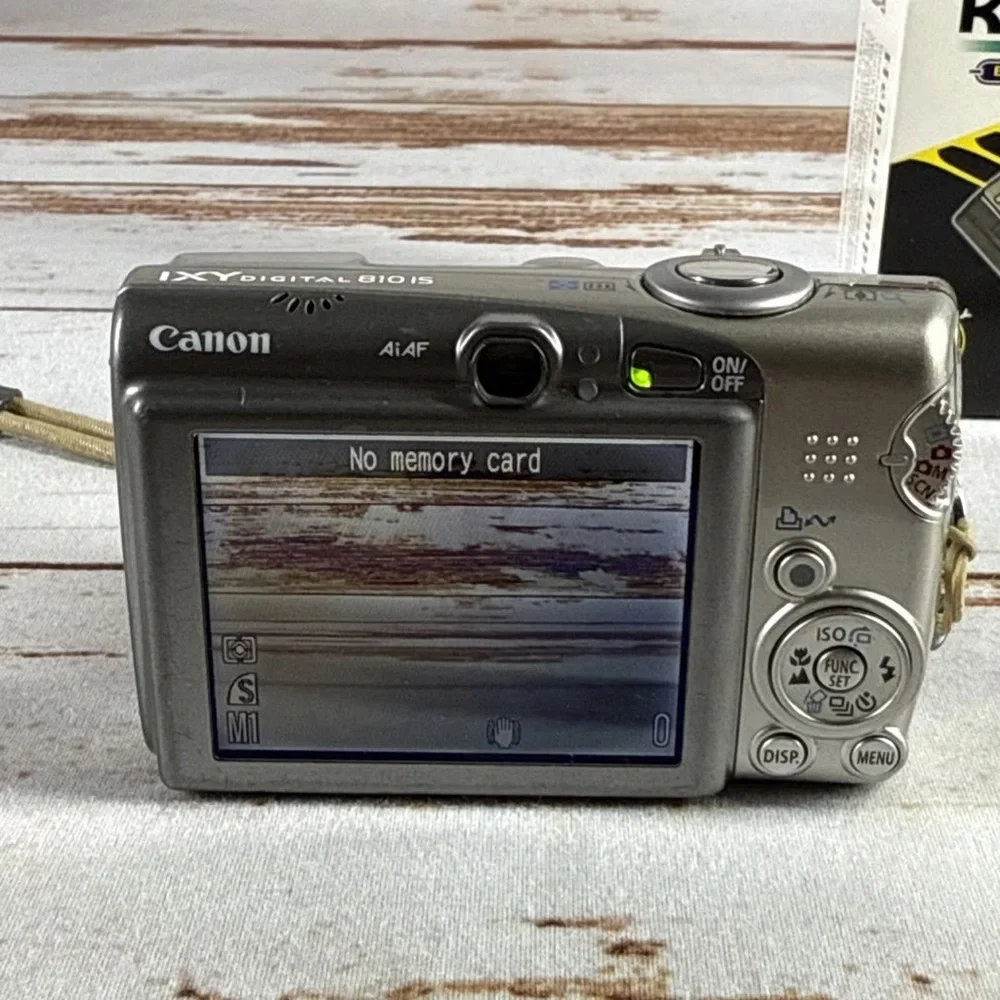 Canon Silver Digital Camera with Kastar Battery Charger